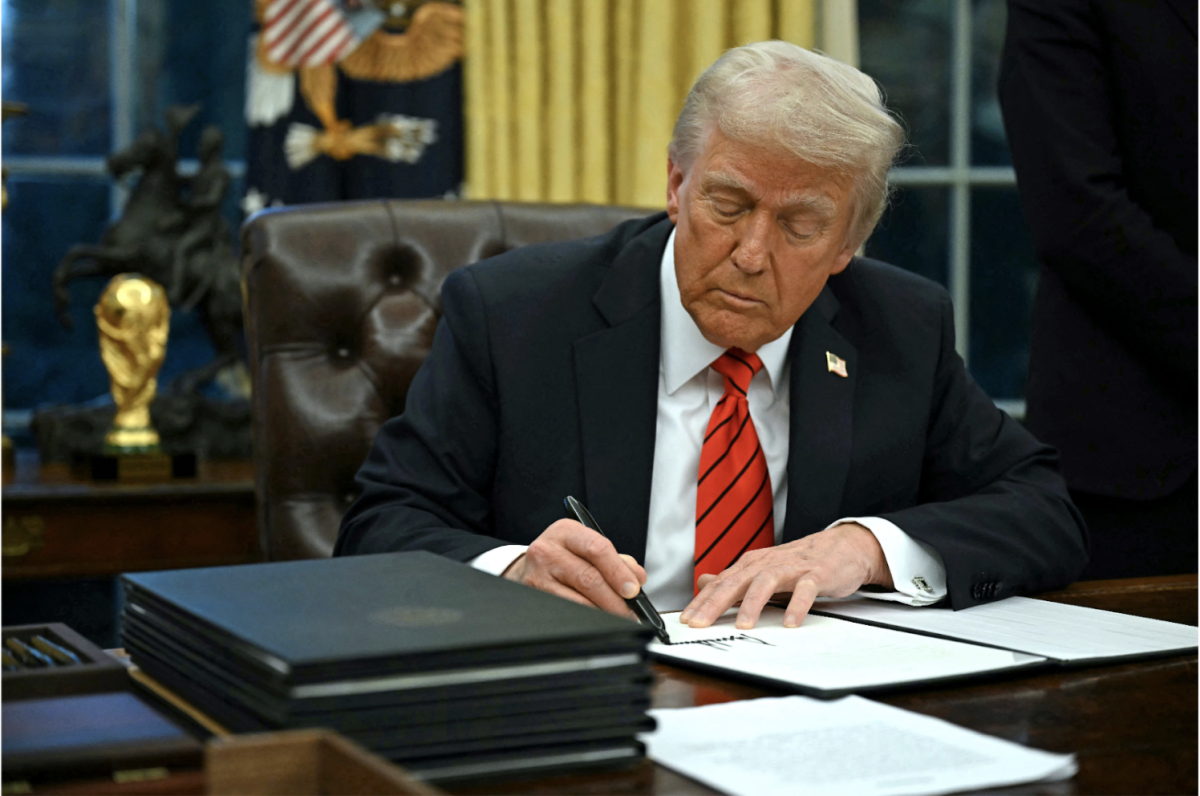 President Trump signing his new executive orders at the start of his term